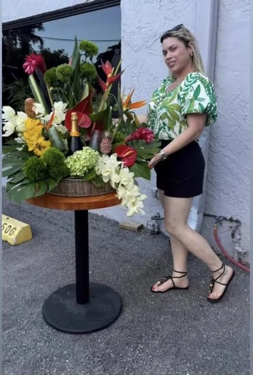 Yaneisy Suarez with a tropical arrangement